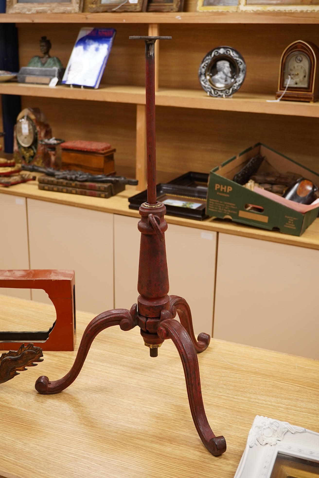 A 19th century red japanned (heavy) cast iron telescopic tripod base, 63cm minimum